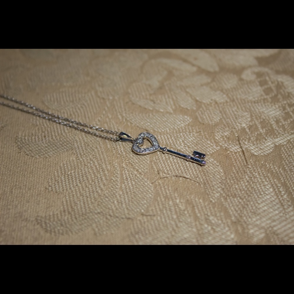 Silver heart key charm necklace